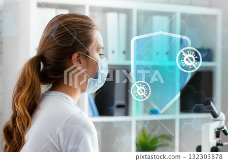 Medical professional analyzes data using microscope in a modern laboratory setting 132303878