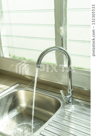 Kitchen Water tap and sink. Renovation and plumbing. 132305533