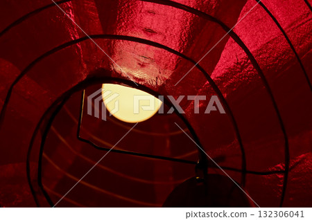 Low angle view of the traditional Chinese lantern.  The lamp inside the traditional red Chinese lantern. Festive decoration. Mid-autumn festival decoration,Chinese New Year decoration, for celebration 132306041