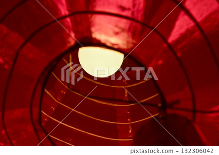Low angle view of the traditional Chinese lantern.  The lamp inside the traditional red Chinese lantern. Festive decoration. Mid-autumn festival decoration,Chinese New Year decoration, for celebration 132306042