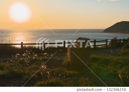 Cape Irago in autumn: View of the sunset from the former defense post with fluttering silver grass 132306258