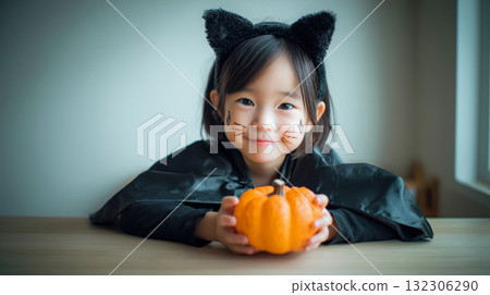 Girl dressed up indoors, autumn daytime, cat ears, pumpkin Girl dressed up indoors, autumn daytime, cat ears, pumpkin 132306290