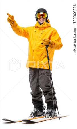 Skiing enthusiast in bright yellow jacket points towards the mountain trail while standing on skis at a snowy ski resort during winter Skiing enthusiast in bright yellow jacket points towards the mountain trail while standing on skis at a snowy ski resort during winter 132306398