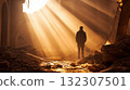 Man Standing in Sunlit Ruins With Bright Rays Shining Through Debris and Dust 132307501