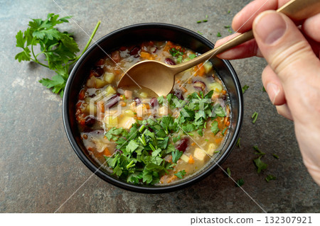 Red bean soup with potatoes, tomatoes, paprika, carrot, and bacon. Red bean soup with potatoes, tomatoes, paprika, carrot, and bacon. 132307921