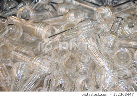 Close up scene of group of preform shape of PET bottle products. Close up scene of group of preform shape of PET bottle products. 132308447