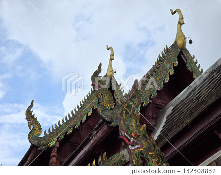 ornate roof of traditional temple features intricate dragon motifs and vibrant colors, showcasing rich cultural heritage and craftsmanship of region 132308832