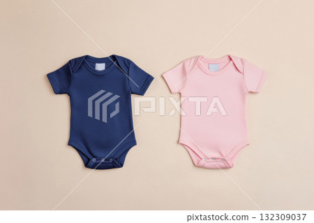 Two Onesie. Blue and pink baby clothes on beige pastel background. Fashion newborn clothes. Flat lay, top view. Baby kids clothing set. Infant cotton bodysuit. Gender. Baby shower concept. Boy or Girl 132309037