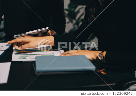 Accounting company provide finance and taxation planning for profitable cash flow, Auditor and accountant team working in office, analyze financial data and accounting record with calculator.Insight 132309242