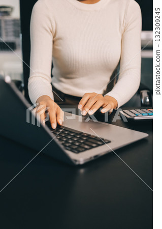 Accounting company provide finance and taxation planning for profitable cash flow, Auditor and accountant team working in office, analyze financial data and accounting record with calculator.Insight Accounting company provide finance and taxation planning for profitable cash flow, Auditor and accountant team working in office, analyze financial data and accounting record with calculator.Insight 132309245