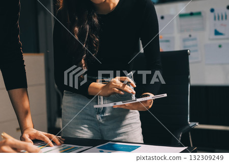 Accounting company provide finance and taxation planning for profitable cash flow, Auditor and accountant team working in office, analyze financial data and accounting record with calculator.Insight Accounting company provide finance and taxation planning for profitable cash flow, Auditor and accountant team working in office, analyze financial data and accounting record with calculator.Insight 132309249