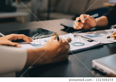 Accounting company provide finance and taxation planning for profitable cash flow, Auditor and accountant team working in office, analyze financial data and accounting record with calculator.Insight 132309254