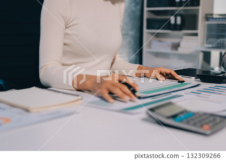 Accounting company provide finance and taxation planning for profitable cash flow, Auditor and accountant team working in office, analyze financial data and accounting record with calculator.Insight Accounting company provide finance and taxation planning for profitable cash flow, Auditor and accountant team working in office, analyze financial data and accounting record with calculator.Insight 132309266