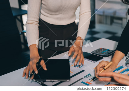 Accounting company provide finance and taxation planning for profitable cash flow, Auditor and accountant team working in office, analyze financial data and accounting record with calculator.Insight 132309274