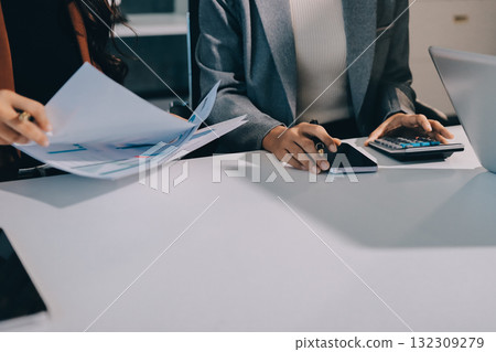 Accounting company provide finance and taxation planning for profitable cash flow, Auditor and accountant team working in office, analyze financial data and accounting record with calculator.Insight Accounting company provide finance and taxation planning for profitable cash flow, Auditor and accountant team working in office, analyze financial data and accounting record with calculator.Insight 132309279