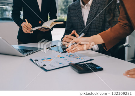 Accounting company provide finance and taxation planning for profitable cash flow, Auditor and accountant team working in office, analyze financial data and accounting record with calculator.Insight Accounting company provide finance and taxation planning for profitable cash flow, Auditor and accountant team working in office, analyze financial data and accounting record with calculator.Insight 132309281