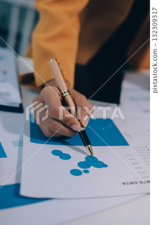 Accounting company provide finance and taxation planning for profitable cash flow, Auditor and accountant team working in office, analyze financial data and accounting record with calculator.Insight Accounting company provide finance and taxation planning for profitable cash flow, Auditor and accountant team working in office, analyze financial data and accounting record with calculator.Insight 132309317