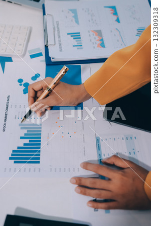 Accounting company provide finance and taxation planning for profitable cash flow, Auditor and accountant team working in office, analyze financial data and accounting record with calculator.Insight Accounting company provide finance and taxation planning for profitable cash flow, Auditor and accountant team working in office, analyze financial data and accounting record with calculator.Insight 132309318
