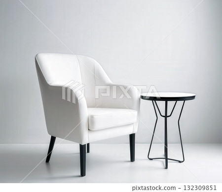 Modern White Armchair With Black Metal Side Table In Minimal Studio Setting. 132309851