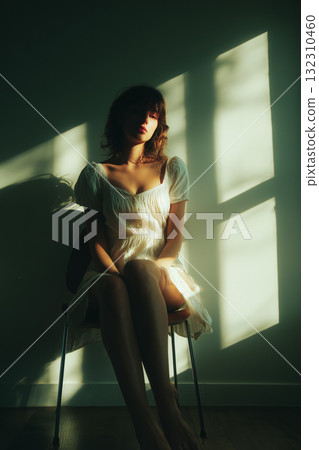 A quiet moment depicted by light and shadow | A sensuous photo of a woman standing by a window A quiet moment depicted by light and shadow | A sensuous photo of a woman standing by a window 132310460