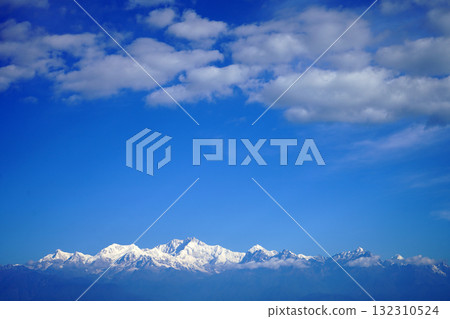 Dramatic Blue Sky and White Clouds Over Kanchenjunga Mountains 132310524