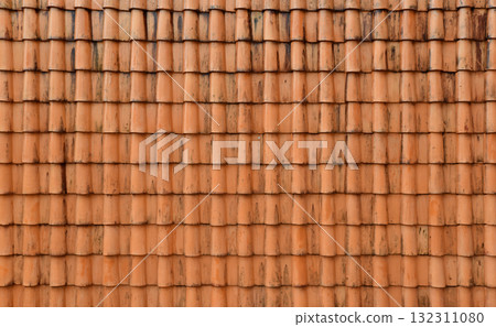 Old orange roof tiles with water stains dirt 132311080
