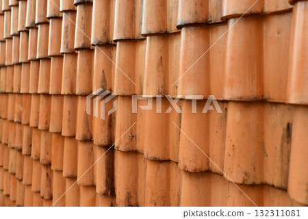 Old orange roof tiles with water stains dirt 132311081