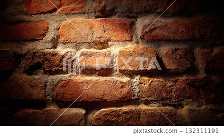 Brick wall texture with dramatic lighting and weathered mortar surface detail. Brick wall texture with dramatic lighting and weathered mortar surface detail. 132311191