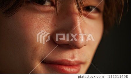 A Japanese man smiles softly and casually 132311498