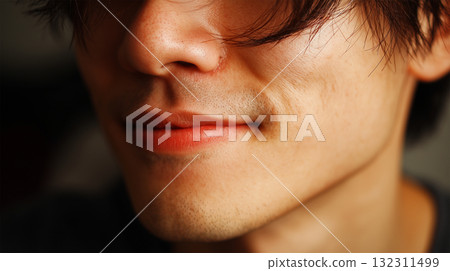 A Japanese man smiles softly and casually 132311499