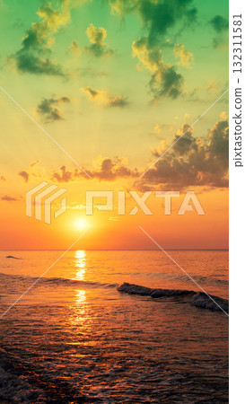 Seascape in the evening. Sunset over the sea. Dramatic sky. Natural landscape. Vertical banner Seascape in the evening. Sunset over the sea. Dramatic sky. Natural landscape. Vertical banner 132311581