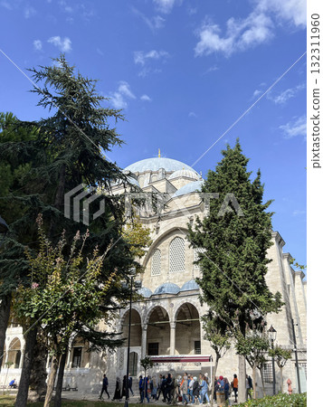 People at the entrance of Suleymaniye mosque in Istanbul, Turkey by Architect Sinan People at the entrance of Suleymaniye mosque in Istanbul, Turkey by Architect Sinan 132311960