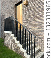 Entrance door and staircase of a brick stone house 132311965