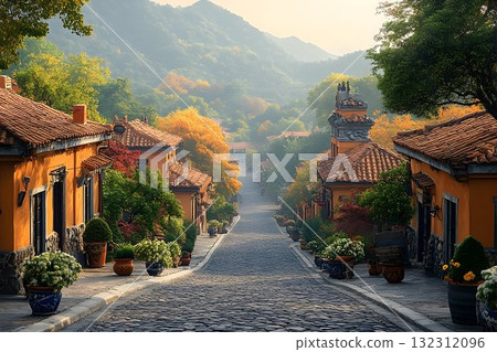 Cobblestone Street Leading to Misty Mountains in a Quaint Autumn Cobblestone Street Leading to Misty Mountains in a Quaint Autumn 132312096