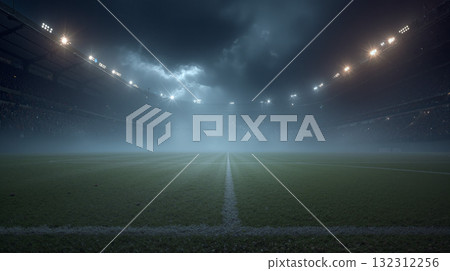 Football field shrouded in mist on a foggy night during a match 132312256
