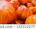 A close up view of vibrant orange pumpkins captures the warmth and richness of the autumn harvest season 132312277