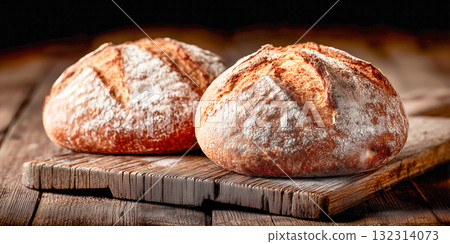 Rustic Artisan Bread Loaves on Wooden Board 132314073