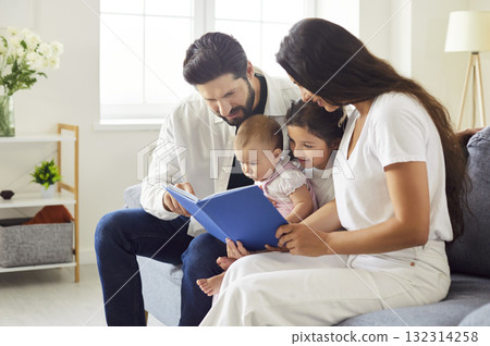 Happy family reading book together Happy family reading book together 132314258