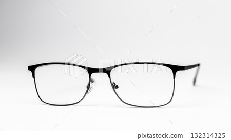 A pair of black glasses with a white frame 132314325