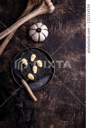 Halloween toast with butter in shape of skull 132314334