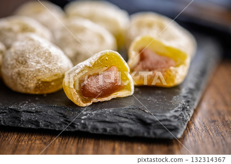 Japanese mochi dessert on plate on wooden table. Japanese mochi dessert on plate on wooden table. 132314367
