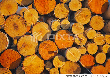 Firewood from logs stacked from birch trees, close-up as a texture 132314887