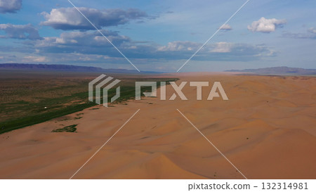 Aerial view of sand dunes in desert at sunset 132314981