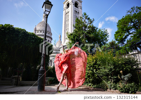 Woman in flowing red dress near Sacre Coeur Paris Woman in flowing red dress near Sacre Coeur Paris 132315144