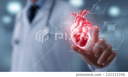 A doctor examines a shimmering, holographic projection of a human heart A doctor examines a shimmering, holographic projection of a human heart 132315348