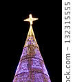 Giant christmas tree illuminated with bright star. 132315555