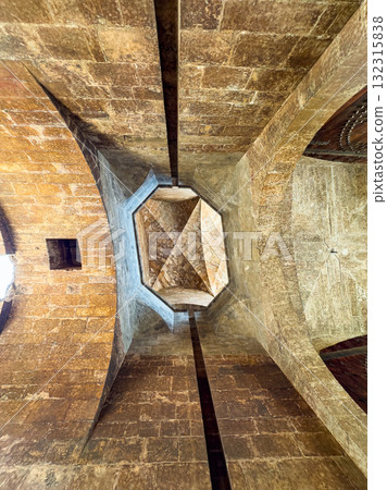 Unique architectural view of a stone ceiling in a historical building captured from below at midday light Unique architectural view of a stone ceiling in a historical building captured from below at midday light 132315838