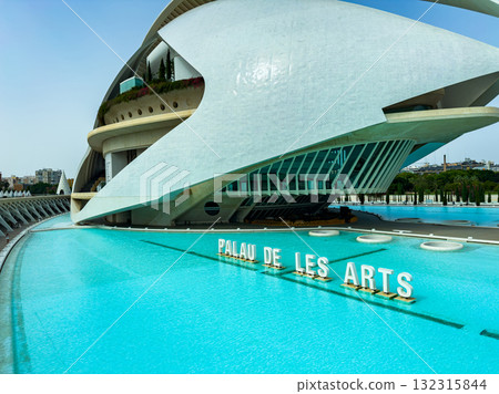 Minor architectural marvels bathed in sunlight by the sparkling waters of the Palau de les Arts in Valencia on a warm afternoon 132315844