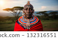 A close-up portrait of a proud Maasai man from Kenya, looking directly at the camera with a stoic and dignified expression. 132316551