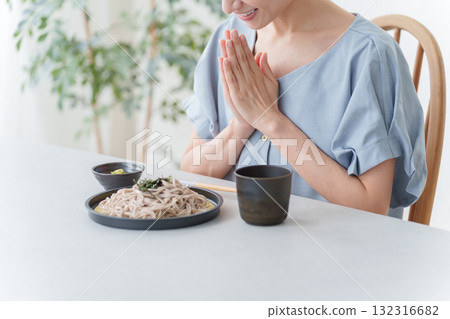 A woman eating cold soba noodles 132316682